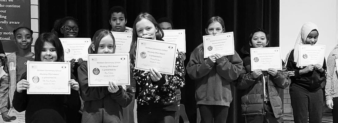 Students holding certificates